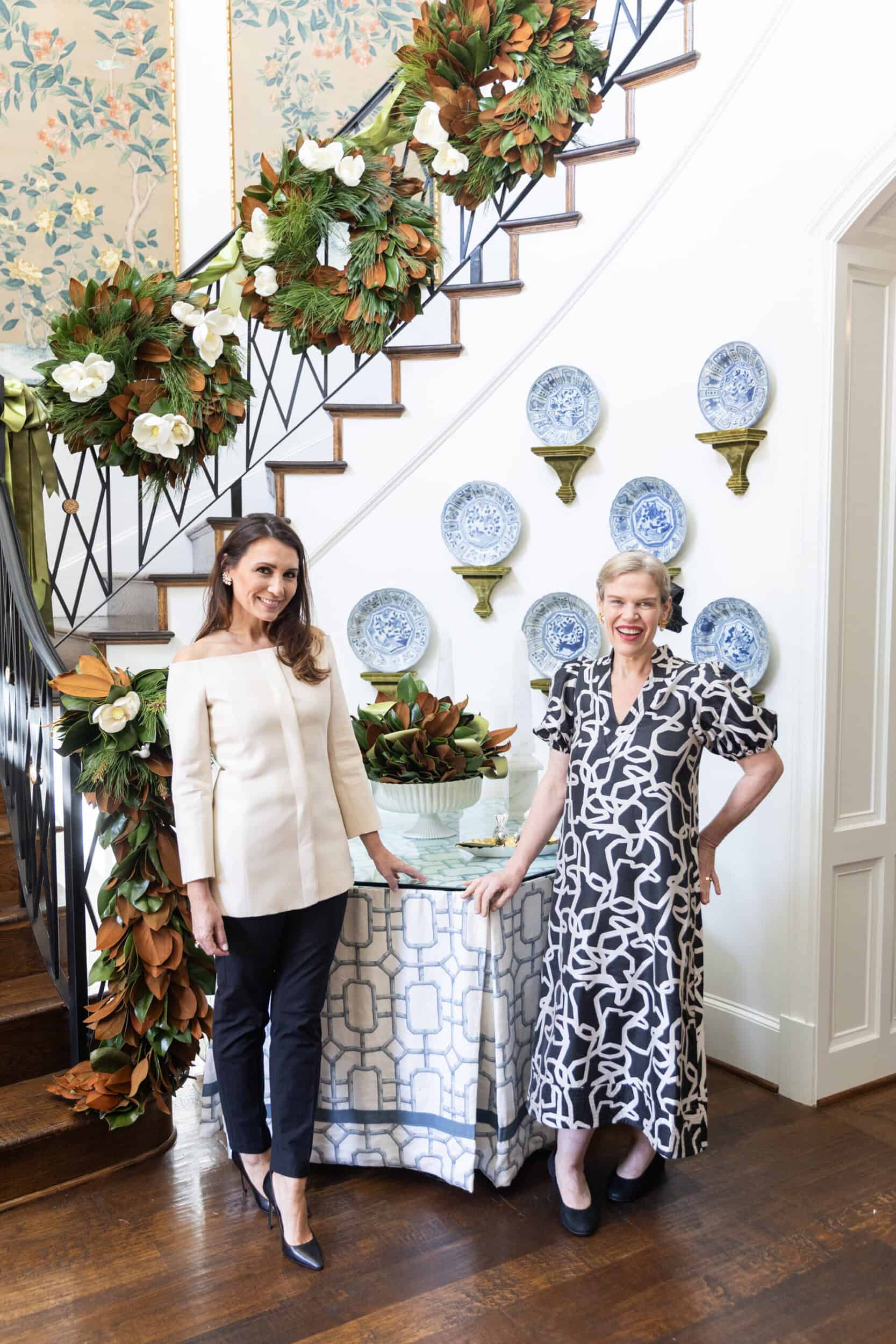 Magnolia wreath from The Dove Collection photographed John Cain Photography by Kimberly Whitman and Weston Farms displayed on a classic Southern front door.